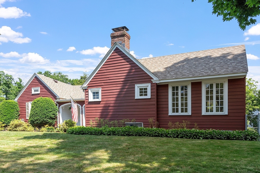 1 Beech Circle Andover, MA 01810 - Photo 32 of 40 a front view of a house with a yard