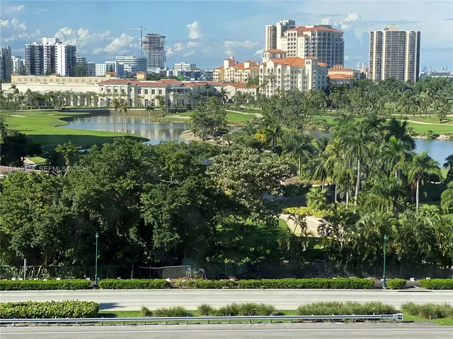 a bathroom with a granite countertop sink toilet a mirror and shower