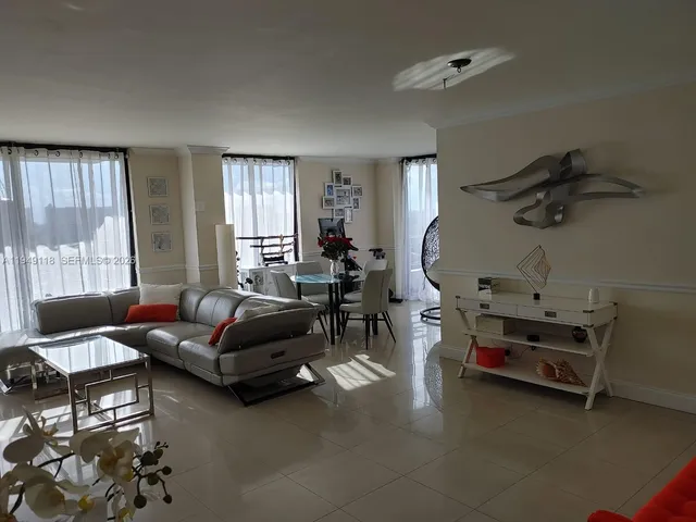 a bed sitting in a room next to a window