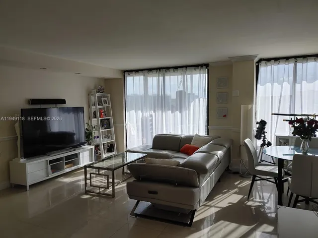 a bathroom with a granite countertop toilet and a sink