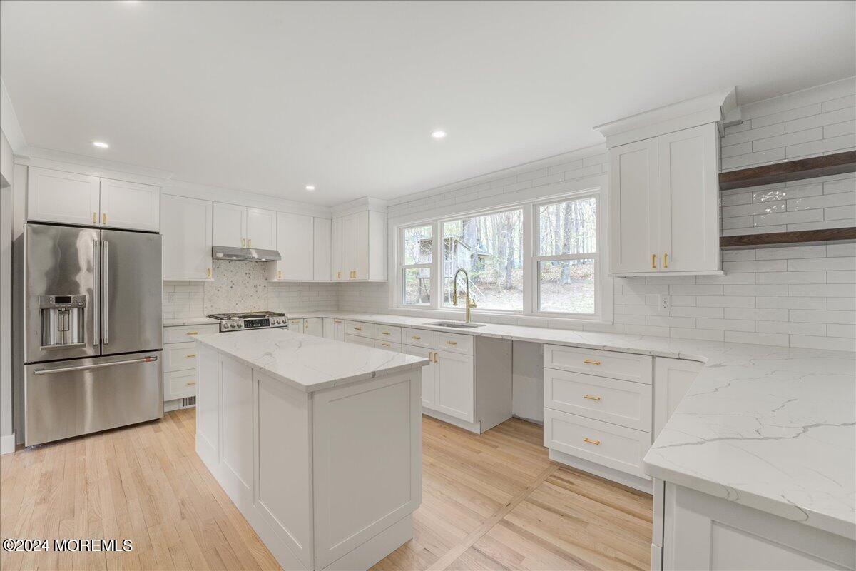 3 Beverly Drive Holmdel, NJ 07733 - Photo 4 of 37 a kitchen with granite countertop white cabinets and stainless steel appliances