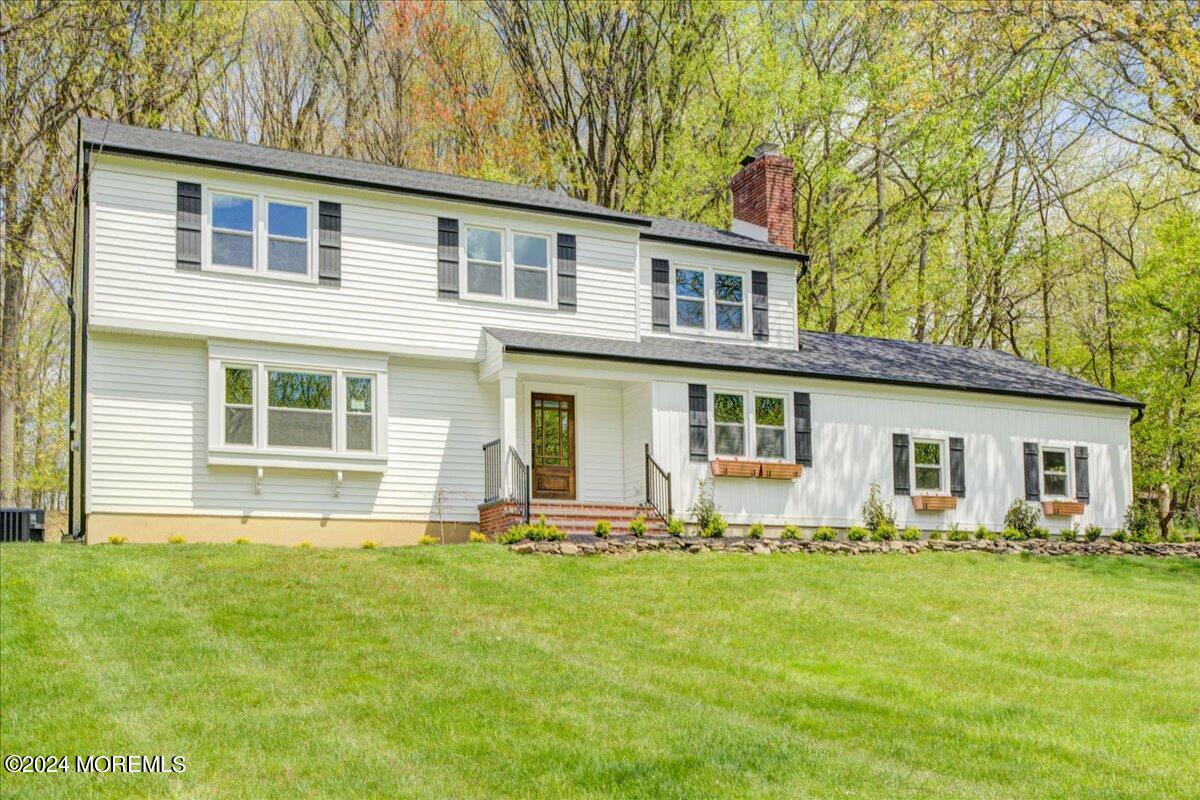 3 Beverly Drive Holmdel, NJ 07733 - Photo 9 of 37 a front view of house with yard and outdoor seating