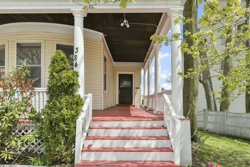 384 Arborway Boston, MA 02130 - Photo 17 of 39 a front view of a house with a yard