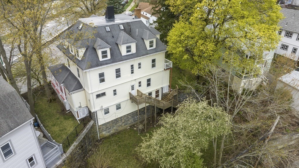 384 Arborway Boston, MA 02130 - Photo 22 of 39 front view of a house with a small yard