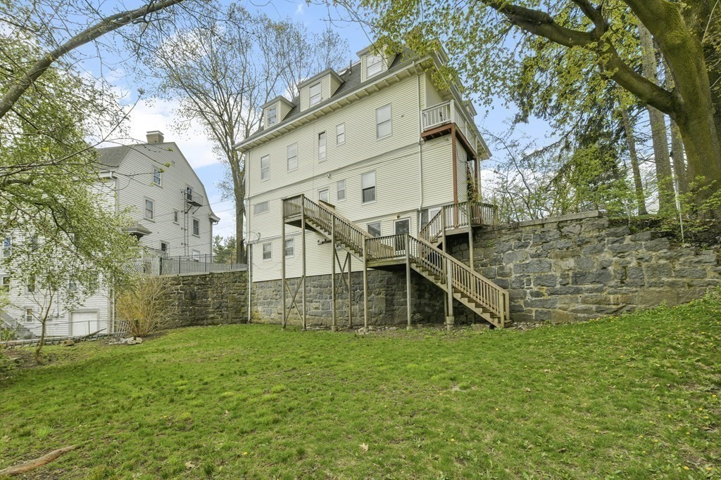 384 Arborway Boston, MA 02130 - Photo 23 of 39 a view of a house with a yard