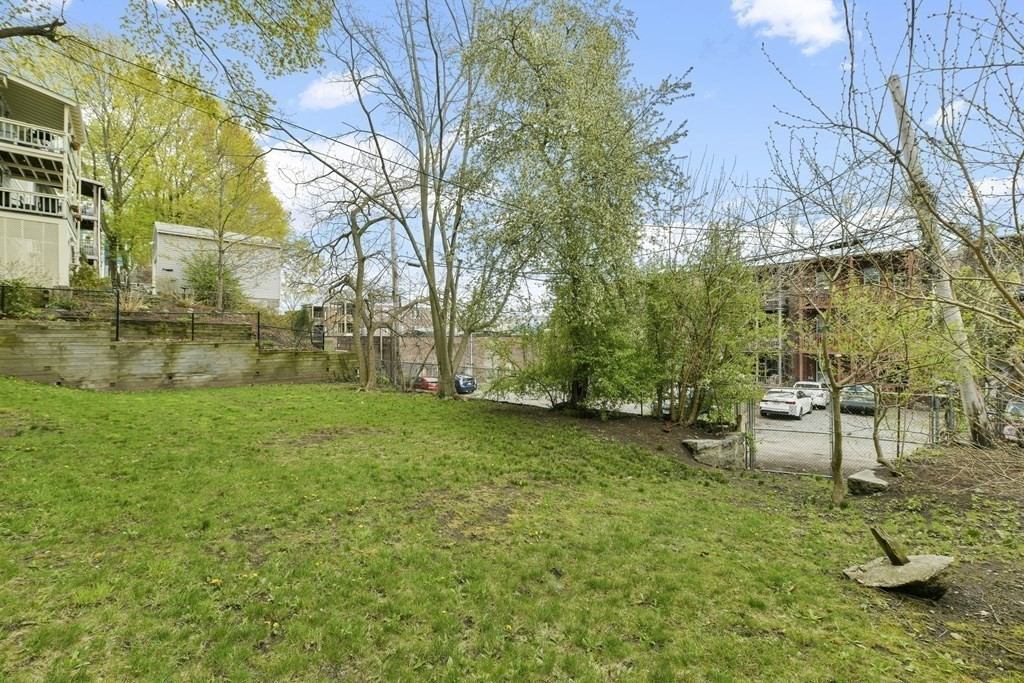 384 Arborway Boston, MA 02130 - Photo 25 of 39 a view of a backyard with sitting area