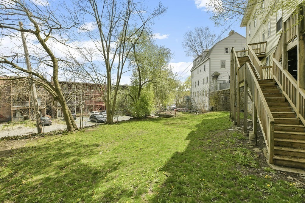 384 Arborway Boston, MA 02130 - Photo 26 of 39 a view of a yard with an trees