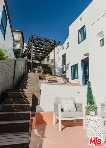a view of a chairs and table on the deck