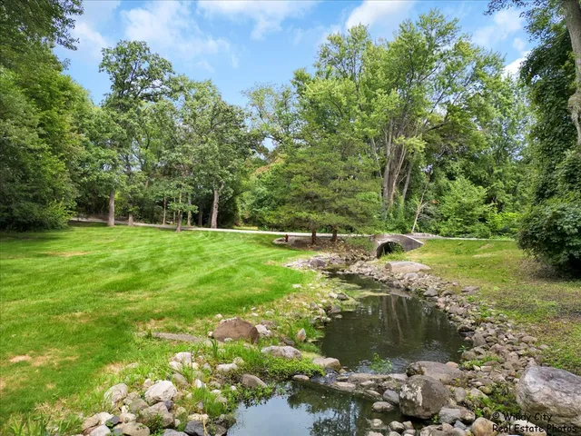 a garden view with a lake