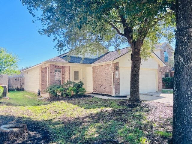 21606 Falvel Lake Drive Spring, TX 77388 - Photo 3 of 24 a front view of house with yard and trees around