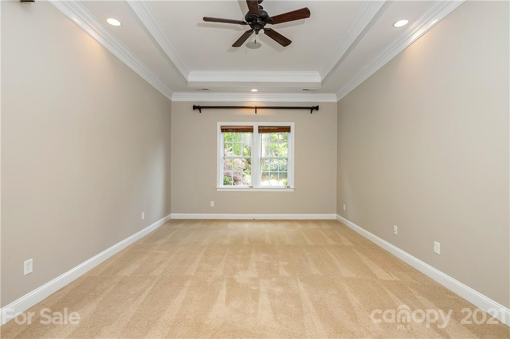 3108 Bridgewick Road Waxhaw, NC 28173 - Photo 18 of 42 a view of a livingroom with a ceiling fan and window