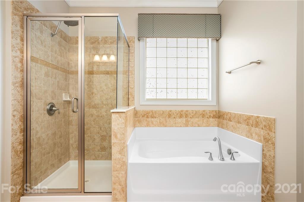 3108 Bridgewick Road Waxhaw, NC 28173 - Photo 23 of 42 a bathroom with a bathtub and shower