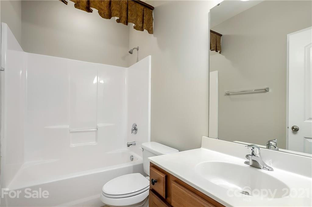 3108 Bridgewick Road Waxhaw, NC 28173 - Photo 31 of 42 a bathroom with a sink toilet tub and shower