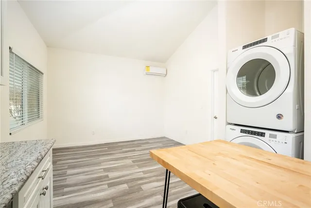 a bedroom with a sink and a bed