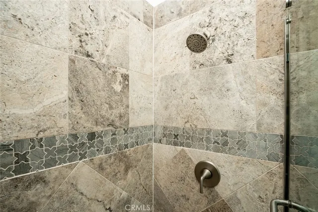 a bathroom with a granite shower
