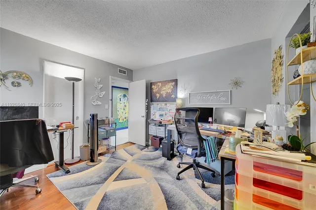 a view of a chair and table in the balcony