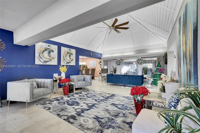 a kitchen with stainless steel appliances kitchen island granite countertop a stove a sink and a refrigerator