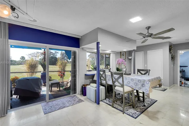 a kitchen with stainless steel appliances kitchen island granite countertop a refrigerator and stove