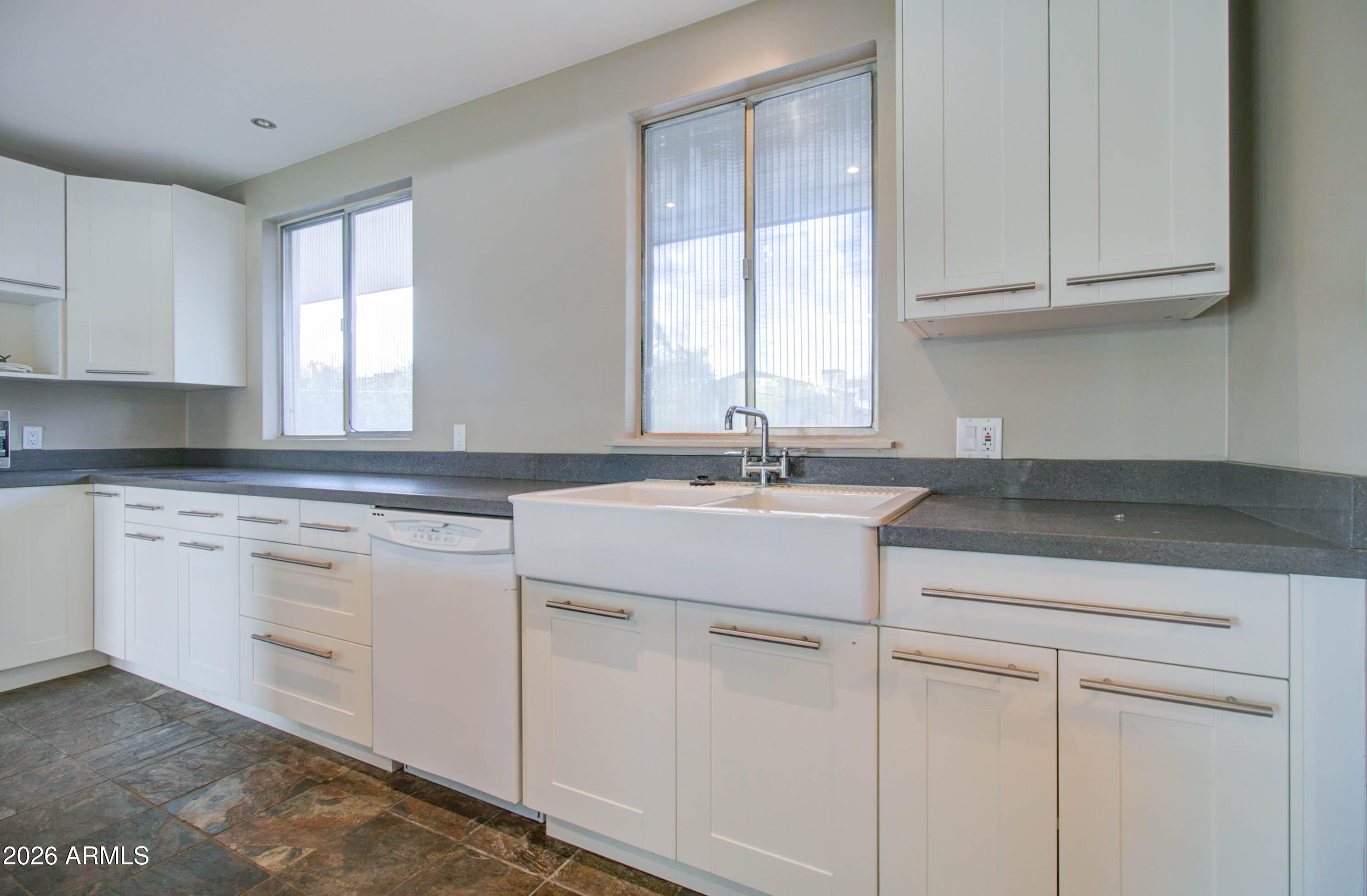 3242 East Camelback Road, Unit 207 Phoenix, AZ 85018 - Photo 8 of 25 Kitchen w/ White Shaker Cabinetry