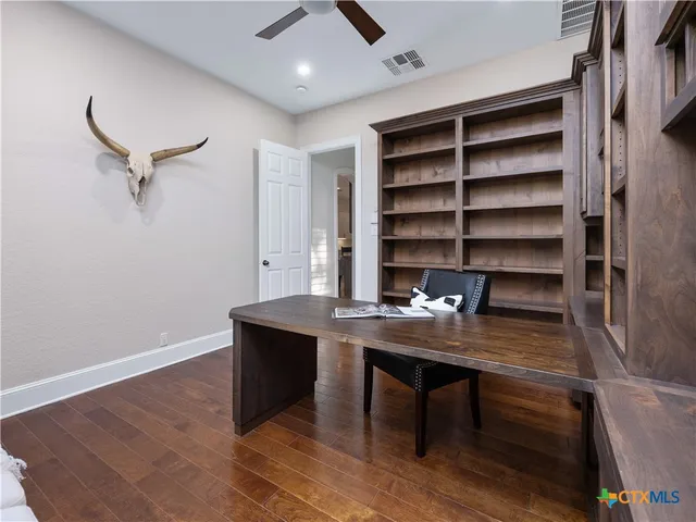 a view of a workspace with furniture