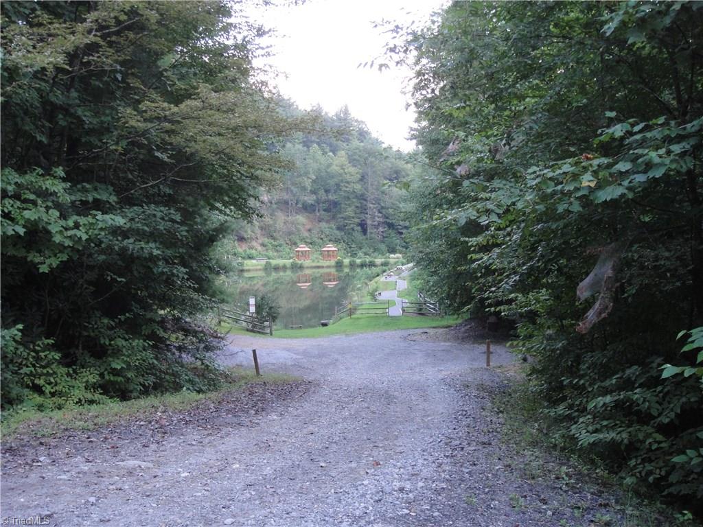 Lot 72-73 Buck Mountain Road Purlear, NC 28665 - Photo 25 of 44 Approaching The Pond at Deer Run behind the Community Center.