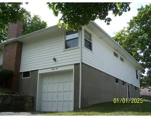 22 Cardinal Road Worcester, MA 01602 - Photo 5 of 31 a view of a house with a garage