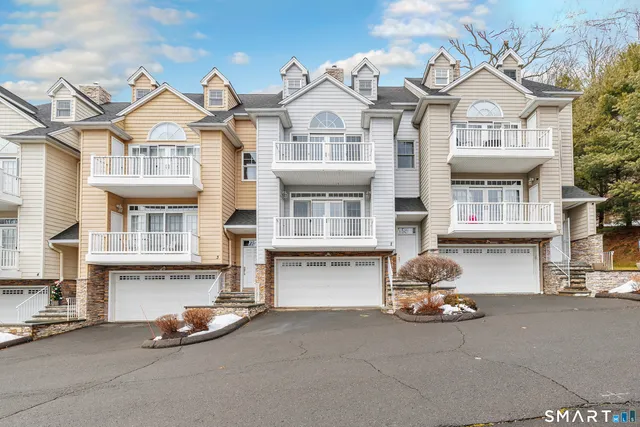 a front view of a building with many windows