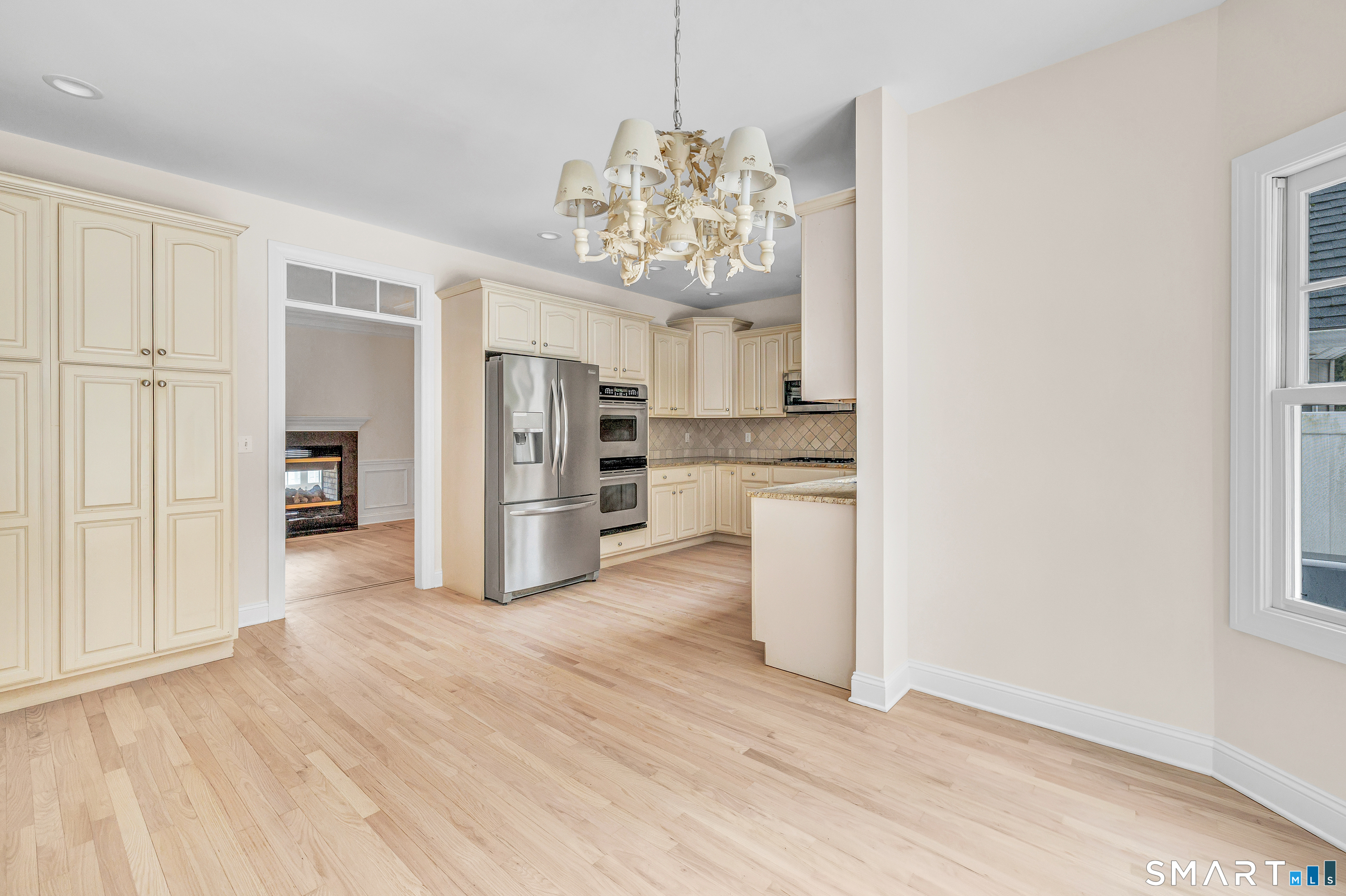 665 River Road, Unit 2 Shelton, CT 06484 - Photo 15 of 33 a view of a kitchen with a refrigerator a microwave and a sink