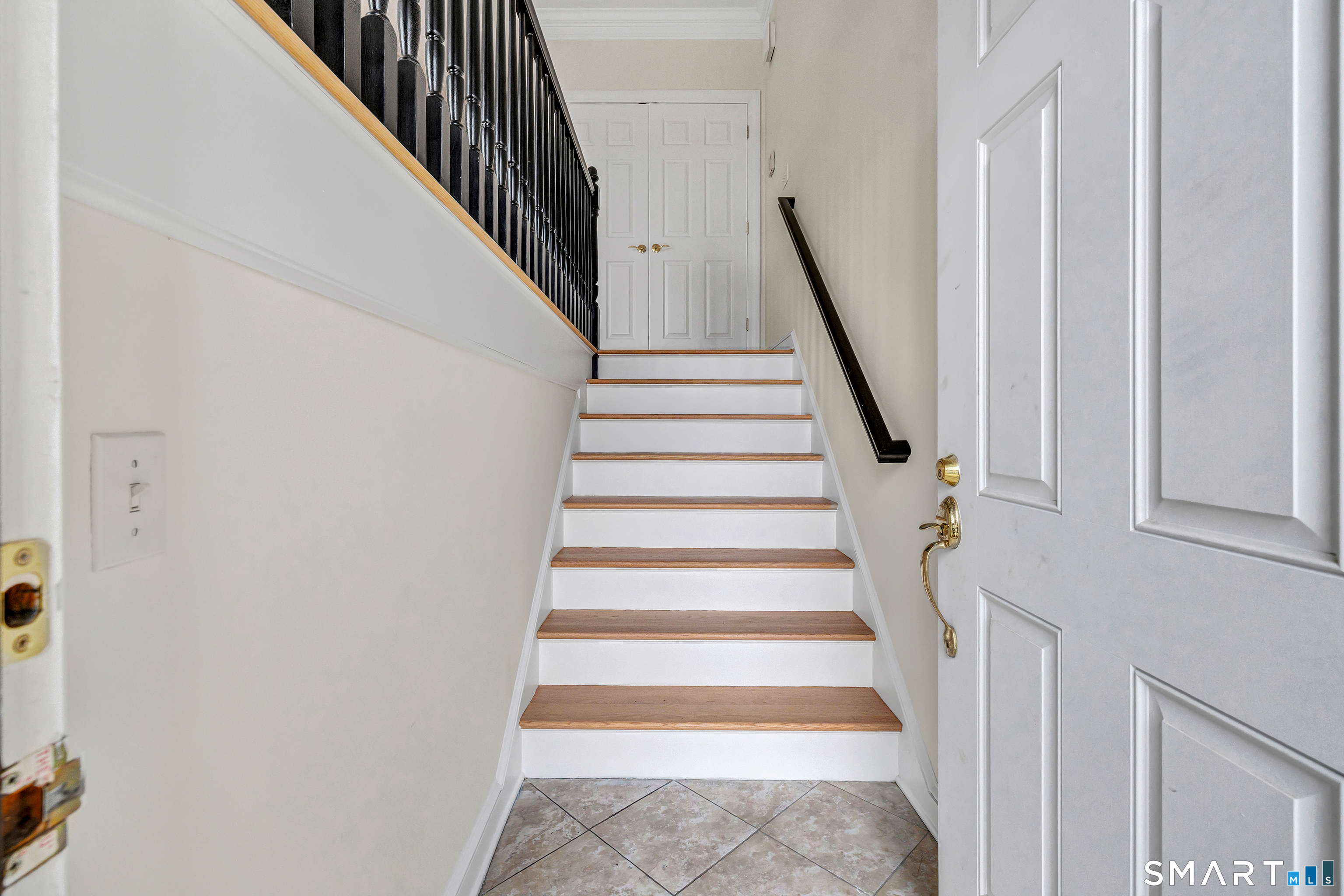 665 River Road, Unit 2 Shelton, CT 06484 - Photo 2 of 33 a view of staircase with wooden floor and white walls