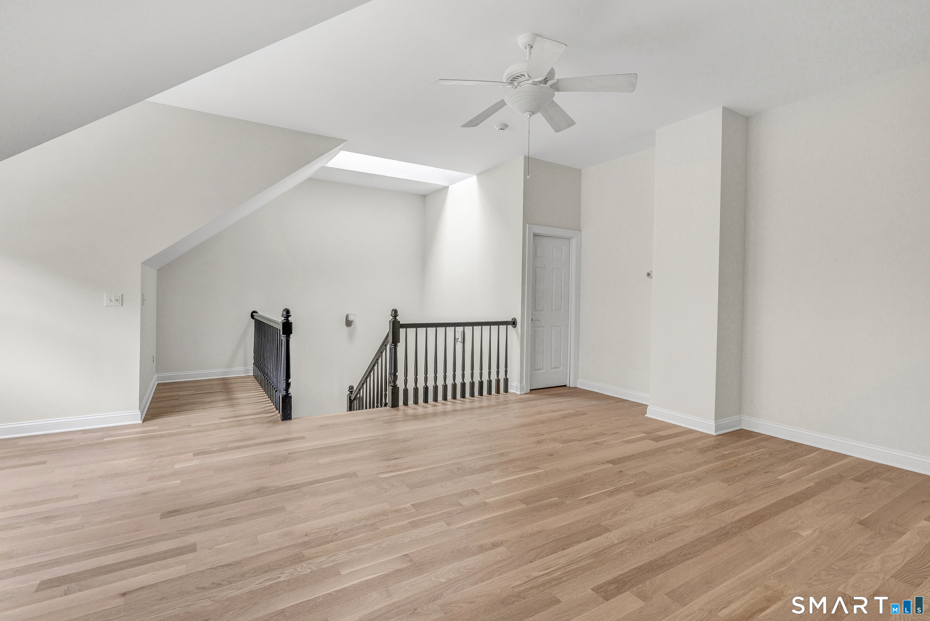 665 River Road, Unit 2 Shelton, CT 06484 - Photo 28 of 33 a view of a room with wooden floor and ceiling fan