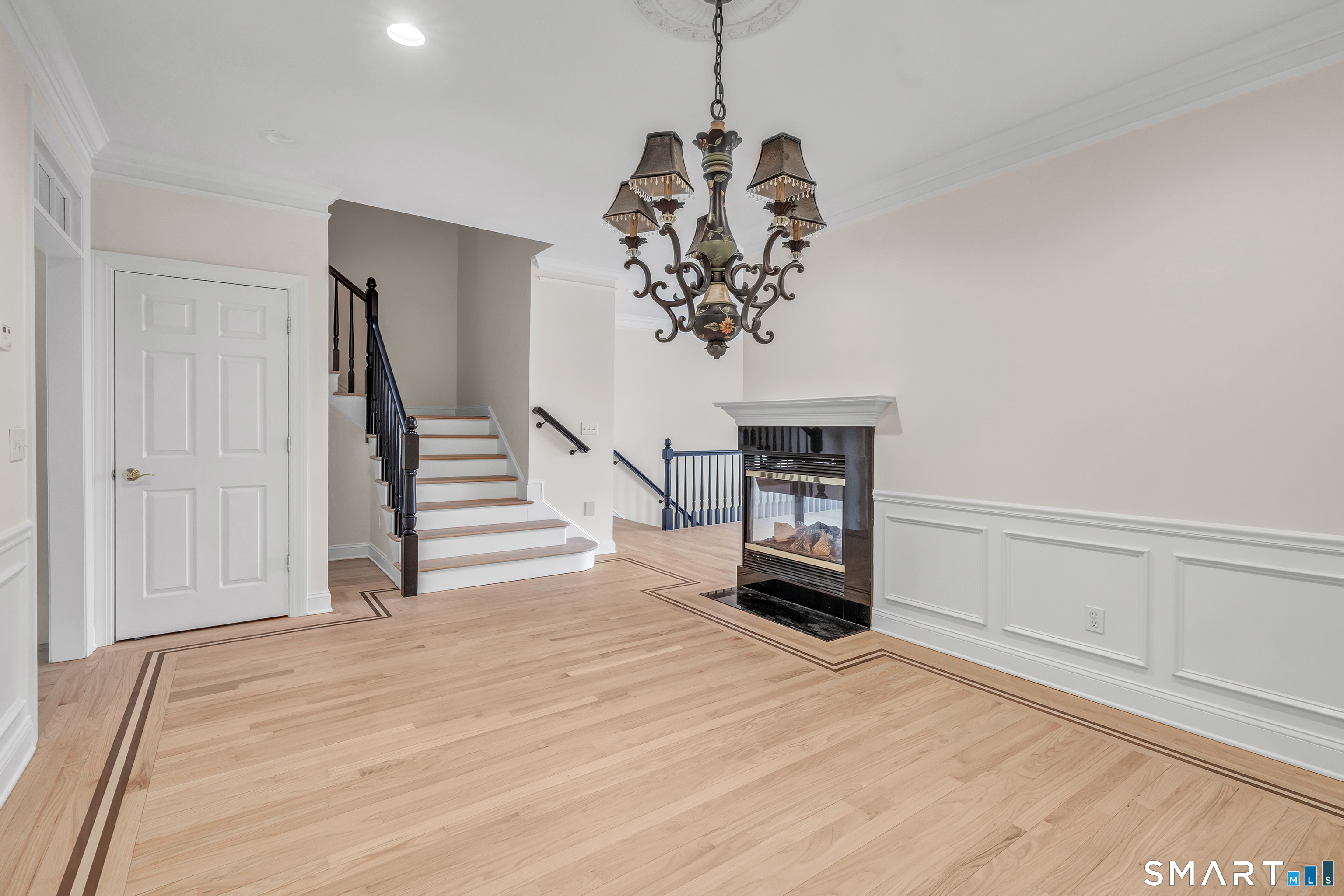 665 River Road, Unit 2 Shelton, CT 06484 - Photo 9 of 33 a view of a livingroom with wooden floor and a ceiling fan