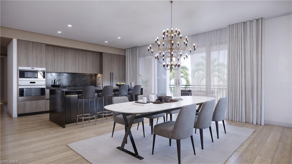 1301 3rd Avenue South Naples, FL 34102 - Photo 7 of 23 a view of a dining room with furniture window and wooden floor