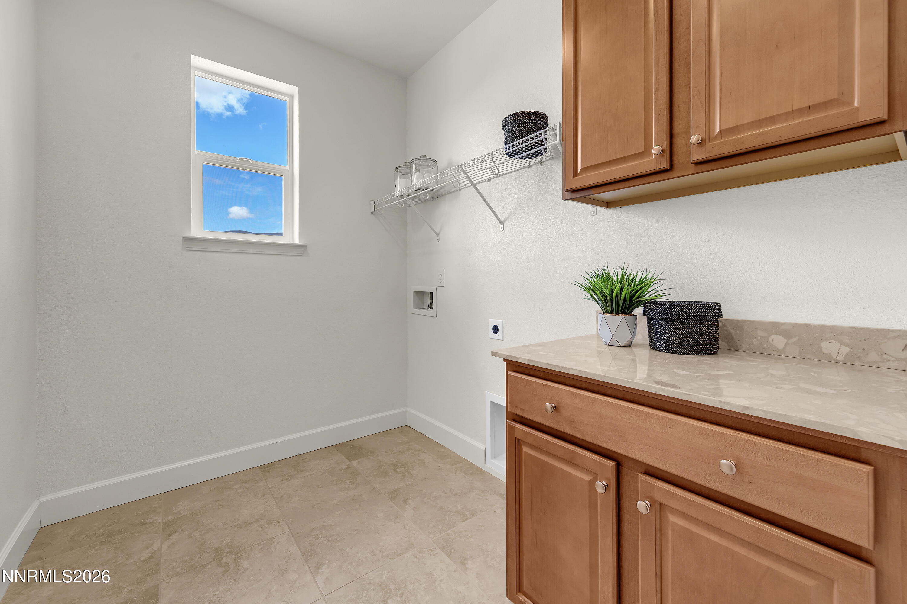 10150 Barrel Racer Drive Reno, NV 89521 - Photo 44 of 64 a kitchen with a sink and cabinets