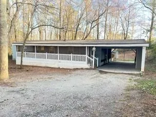 a view of outdoor space with deck and tree s