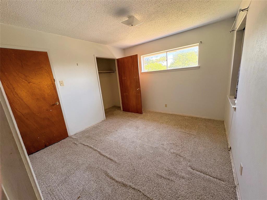 1829 South Center Street Denison, TX 75021 - Photo 23 of 29 an empty room with windows