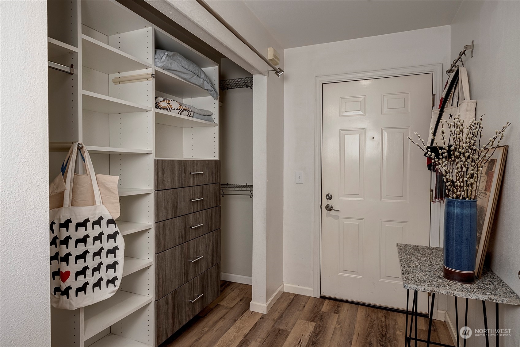 3028 Western Avenue, Unit 408 Seattle, WA 98121 - Photo 20 of 40 a view of walk in closet with clothes and shoes