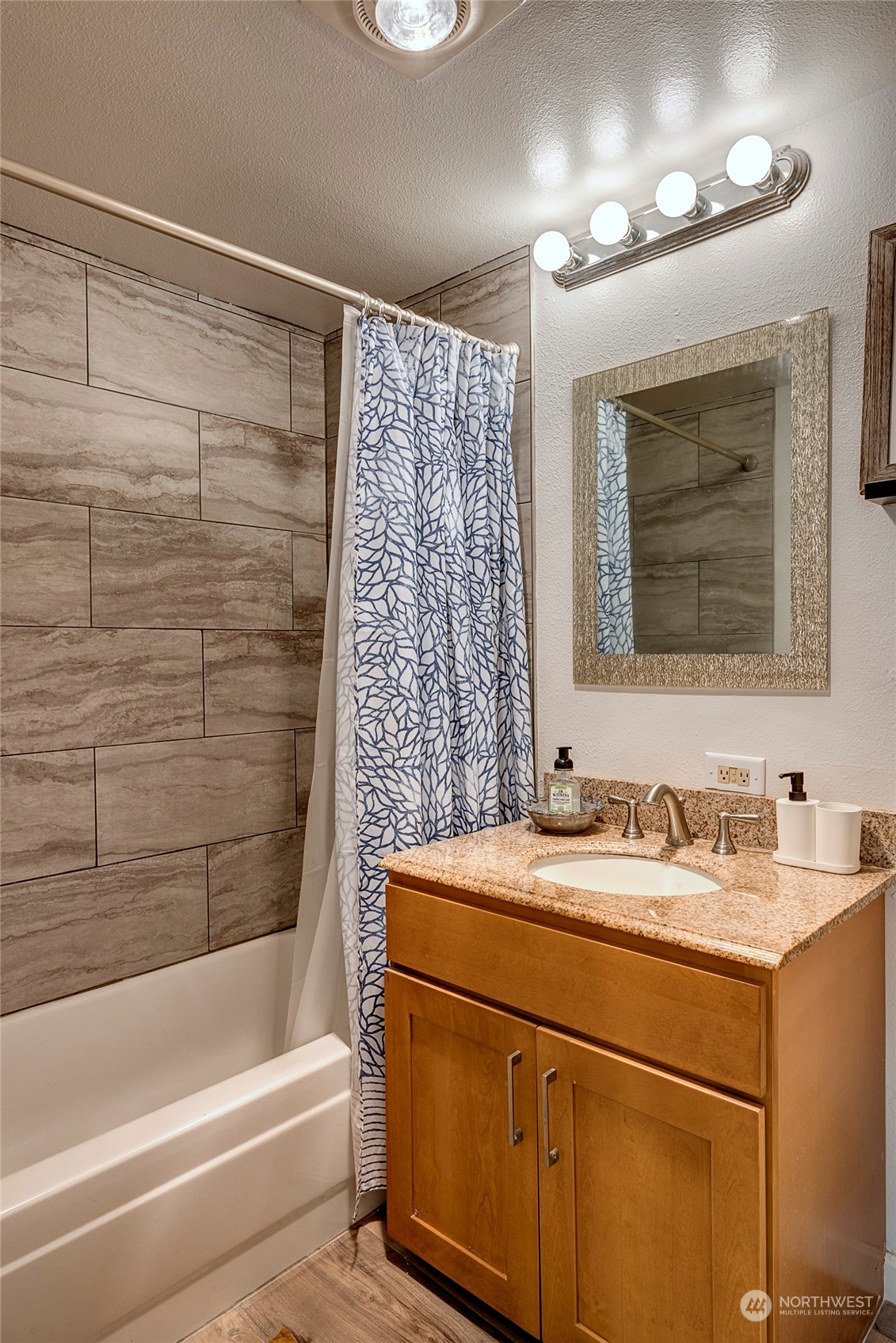 3028 Western Avenue, Unit 408 Seattle, WA 98121 - Photo 23 of 40 a bathroom with a sink and a mirror