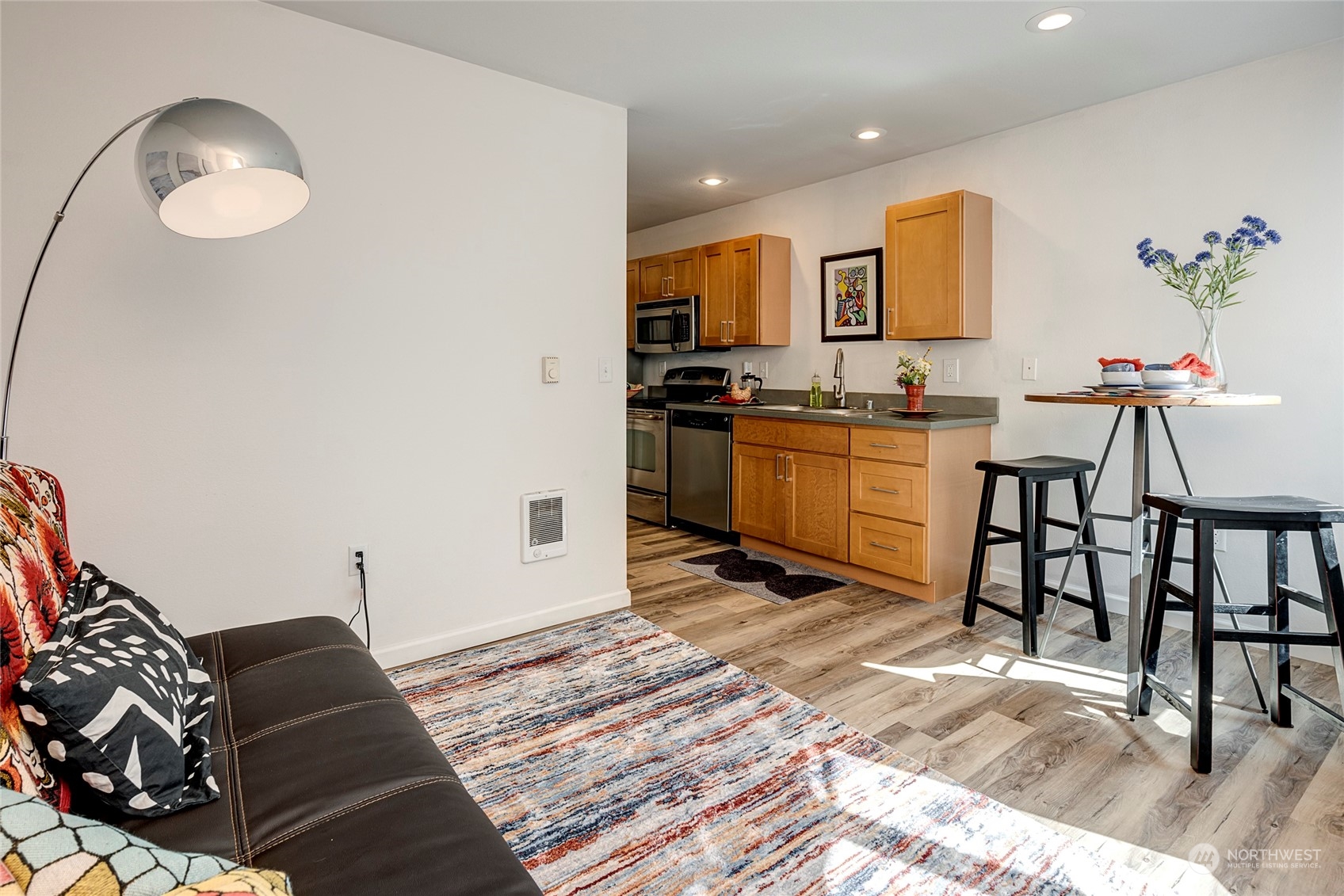 3028 Western Avenue, Unit 408 Seattle, WA 98121 - Photo 34 of 40 a living room with granite countertop furniture a rug and a chandelier