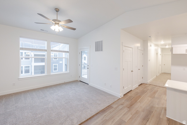 4661 Poplar Way, Unit R304 Mapleton, UT 84664 - Photo 16 of 17 Spare room featuring lofted ceiling, light wood-type flooring, and ceiling fan