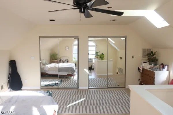 a bedroom with furniture and a chandelier