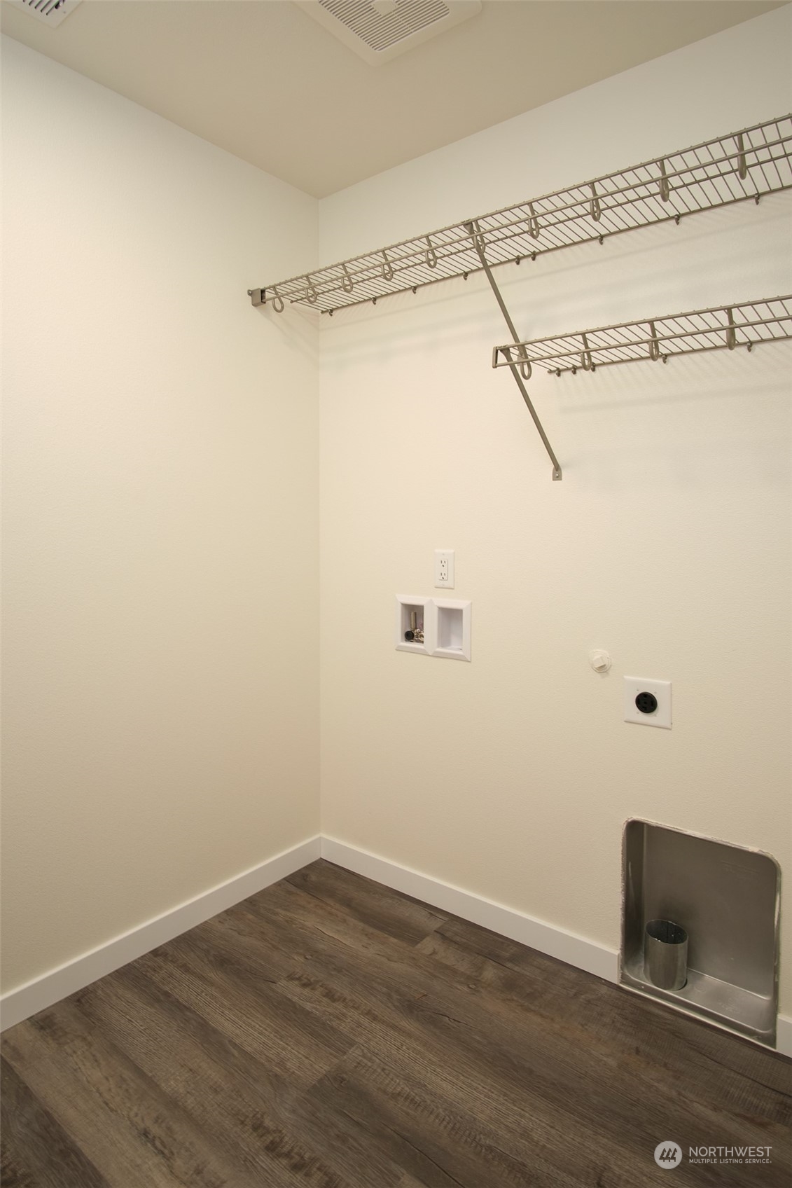 1070 Rw Fletcher Street Winlock, WA 98596 - Photo 13 of 21 a view of a small space with wooden floor and windows