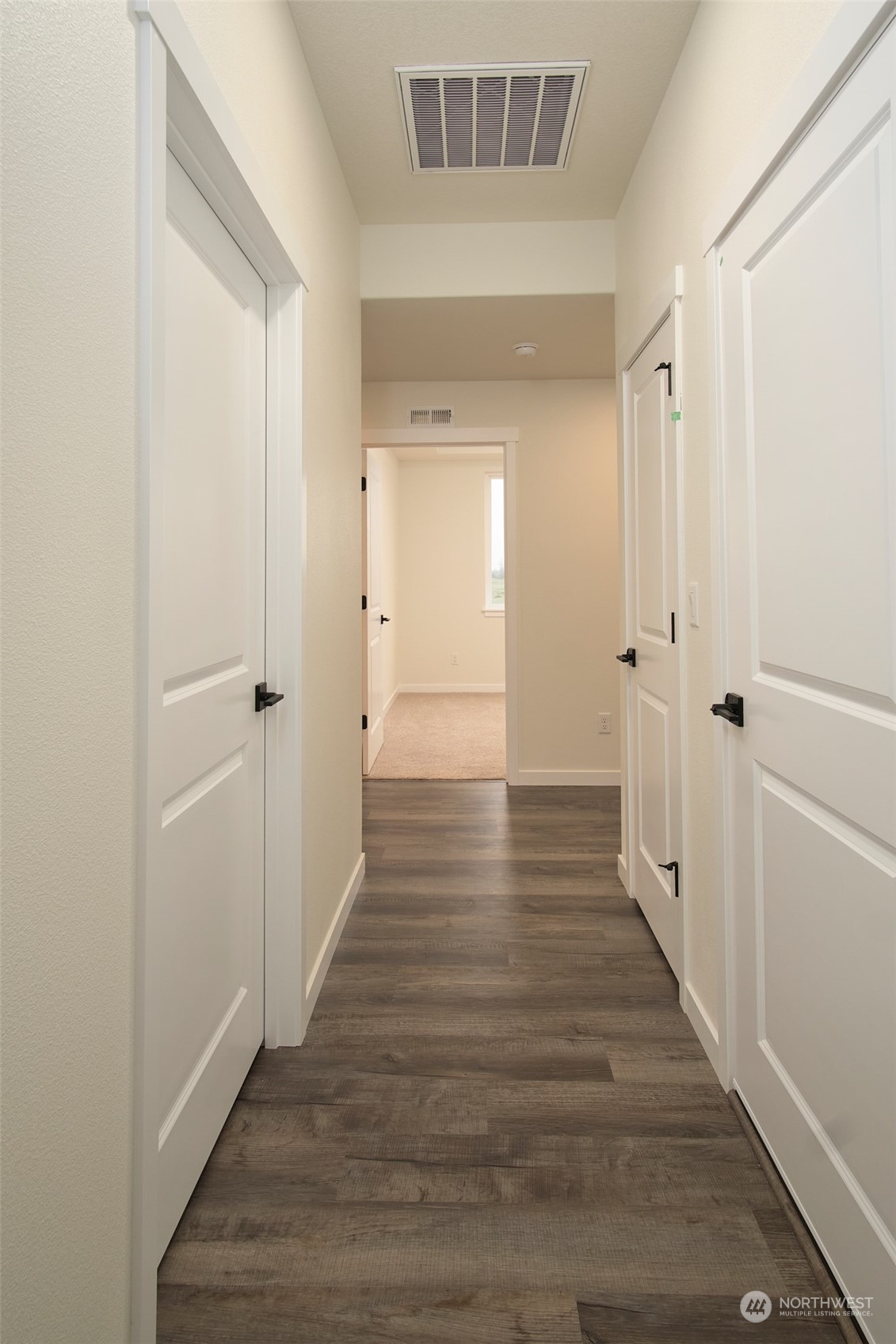 1070 Rw Fletcher Street Winlock, WA 98596 - Photo 8 of 21 a view of a hallway with wooden floor and closet area