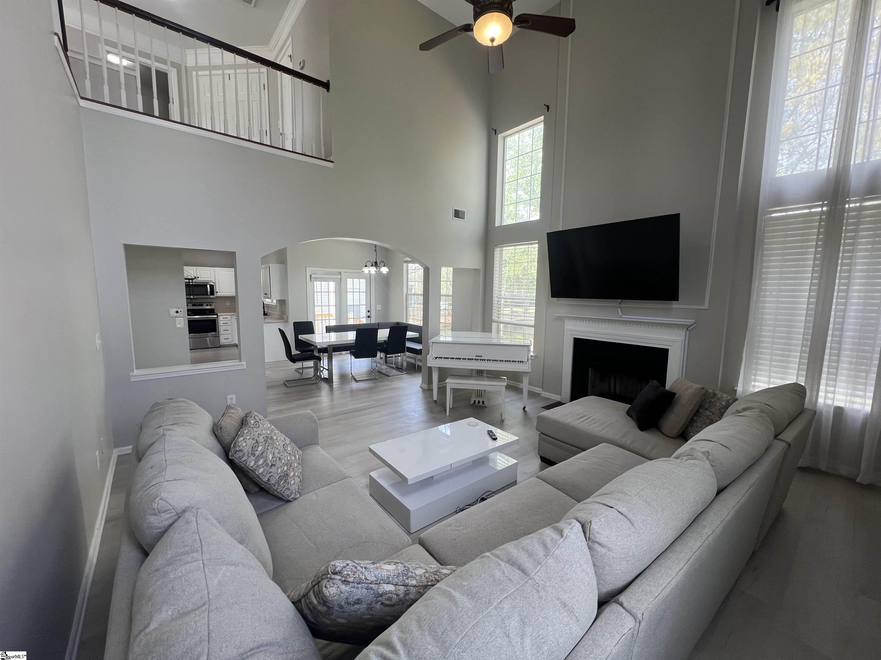 522 Peach Grove Place Mauldin, SC 29662 - Photo 12 of 36 Elegant Baby Grand Piano, and comfy sofa.