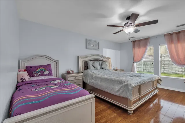 a bathroom with a granite countertop sink mirror and a bath tub