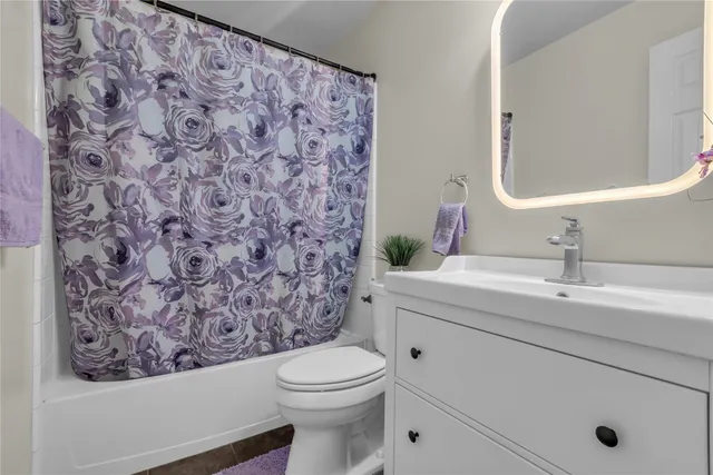 a utility room with sink dryer and washer