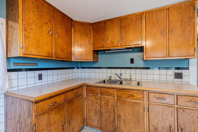 a kitchen with stainless steel appliances granite countertop a sink and cabinets