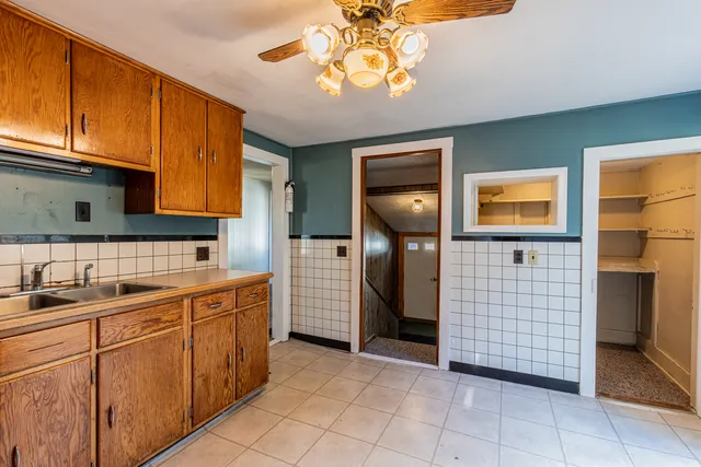 a kitchen with a sink and cabinets