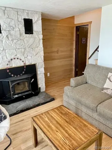 a living room with a flat screen tv and a fireplace