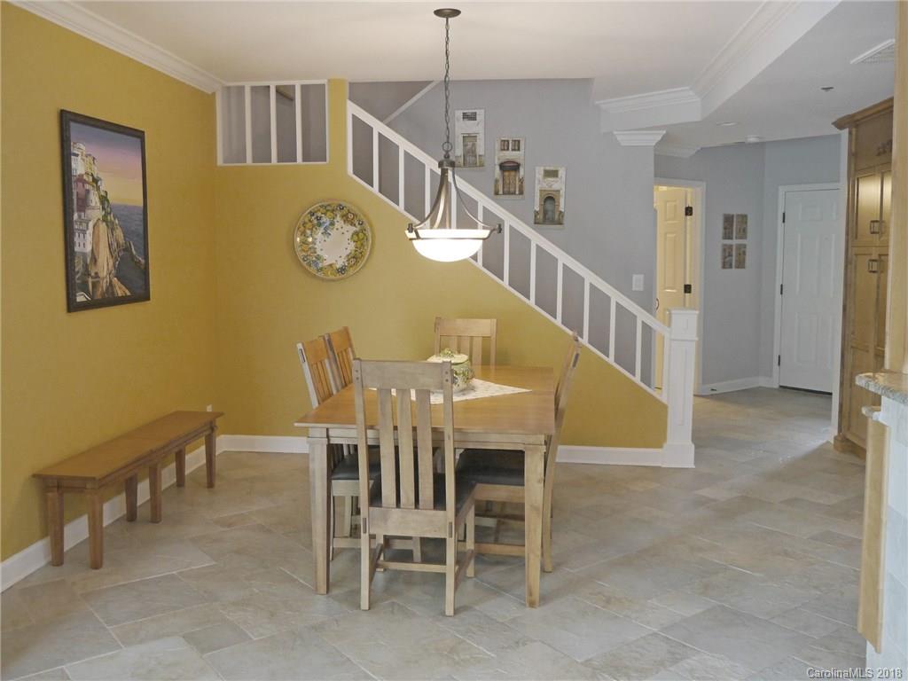 17925 Kings Point Drive, Unit F Cornelius, NC 28031 - Photo 17 of 36 a view of a dining room with furniture