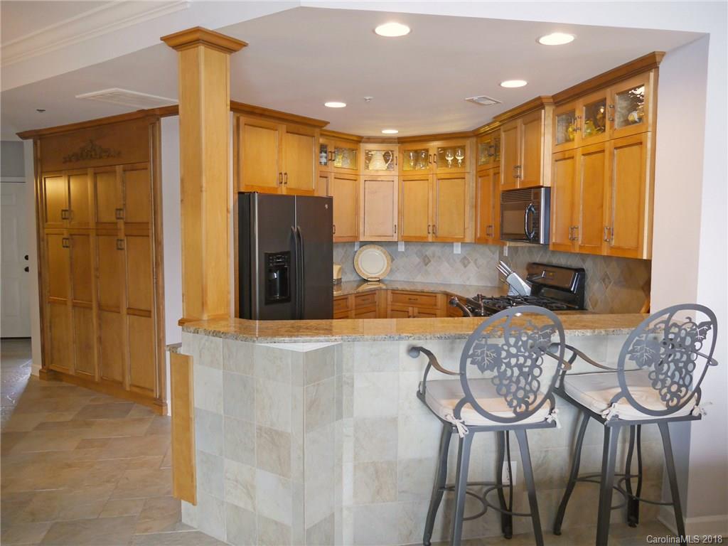 17925 Kings Point Drive, Unit F Cornelius, NC 28031 - Photo 18 of 36 a living room with furniture and a window